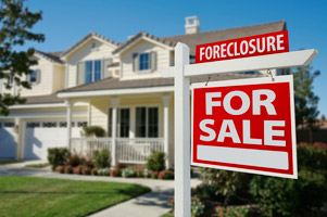 Foreclosure sign in front of a house